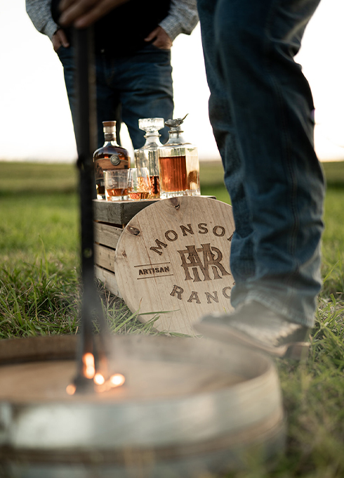 burner-and-liquor-on-barrel