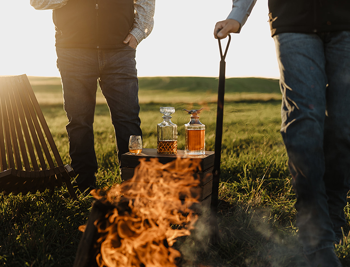 two-men-glasses-behind-fire